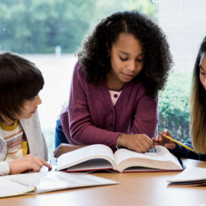 Teacher working with middle school students